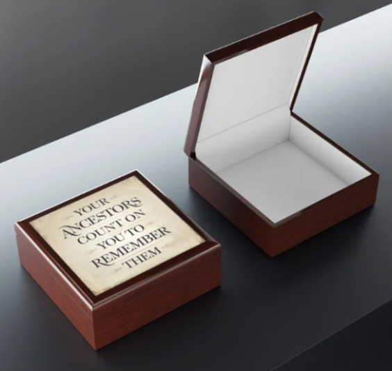 Introducing the "It’s Your Ancestors Count on You to Remember Them" jewelry box—a beautiful tribute to the timeless treasures passed down through generations. For those who carry the legacy of their family in their hearts and hold onto heirlooms that tell stories of the past, this jewelry box is more than just a place to store valuables; it's a guardian of memories.

Crafted with care, this box features a high-quality rubberwood exterior with a varnish finish that gleams with a rich, glossy elegance. The dual hinges, locking at a 90-degree angle, ensure that every time you open it, you’re met with a soft felt-lined interior, perfect for cradling those precious pieces of history. Whether it’s a grandmother’s locket, a father’s cufflinks, or a collection of keepsakes that have been lovingly preserved, this box keeps them safe and close to your heart.

Adorned with a 6" x 6" glossy sublimation ceramic tile on the lid, this jewelry box is a fitting gift for genealogists, family historians, or anyone who understands the deep connection between the past and the present. Let this jewelry box be a symbol of the trust your ancestors have placed in you to remember them, preserving their stories for future generations.